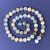 Perles de calcite, boules lisses 8 mm sur fil, longueur 39 cm+