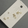 Boucles d'oreilles puces et cuffs pour l'oreille en métal doré avec strass blancs
