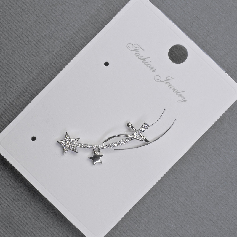 Puce d'oreille dorée avec cabochon et strass blancs 11 × 28 mm ±