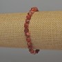 Bracelet en cornaline facettée en losanges, diamètre 6 mm ±, longueur 18 cm ±, élastique