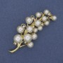 Broche «Branche de Majorque» strass doré, métal doré, 70 × 28 mm +