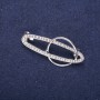 Broche Accent Orbite strass blancs 43×20 mm métal argenté