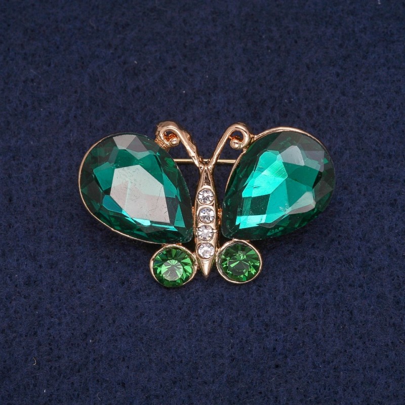 Broche papillon avec cristaux verts et blancs, métal doré 23×34 mm