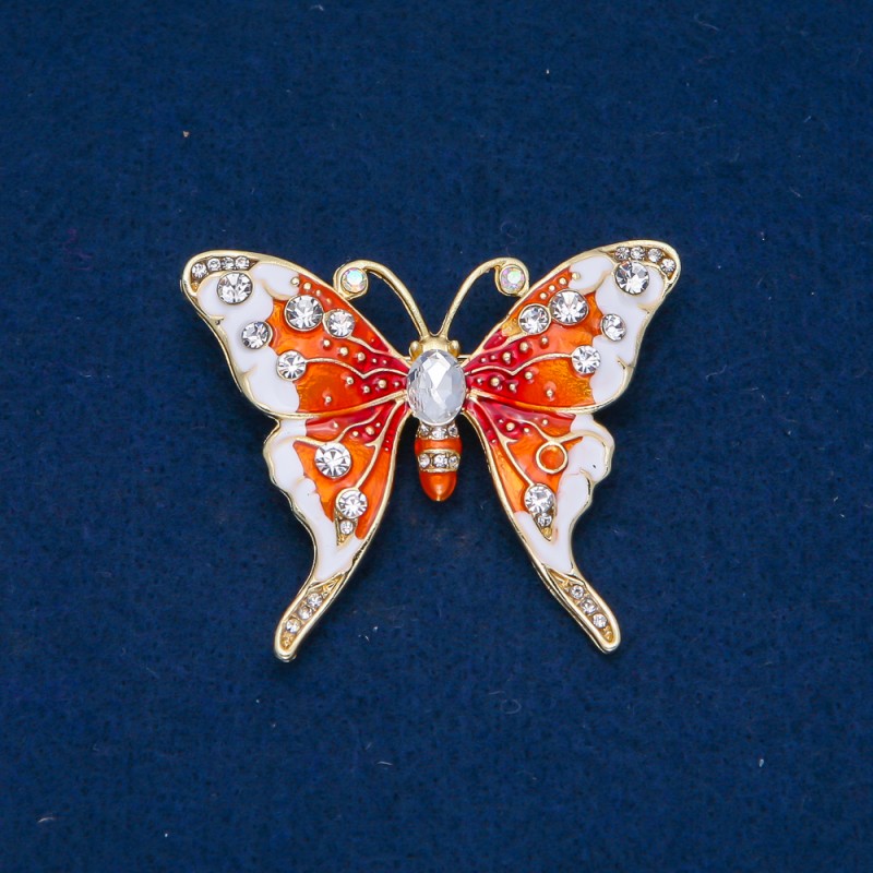 Broche Papillon en métal doré, émail et strass blancs 43×52 mm +