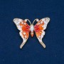 Broche Papillon en métal doré, émail et strass blancs 43×52 mm +