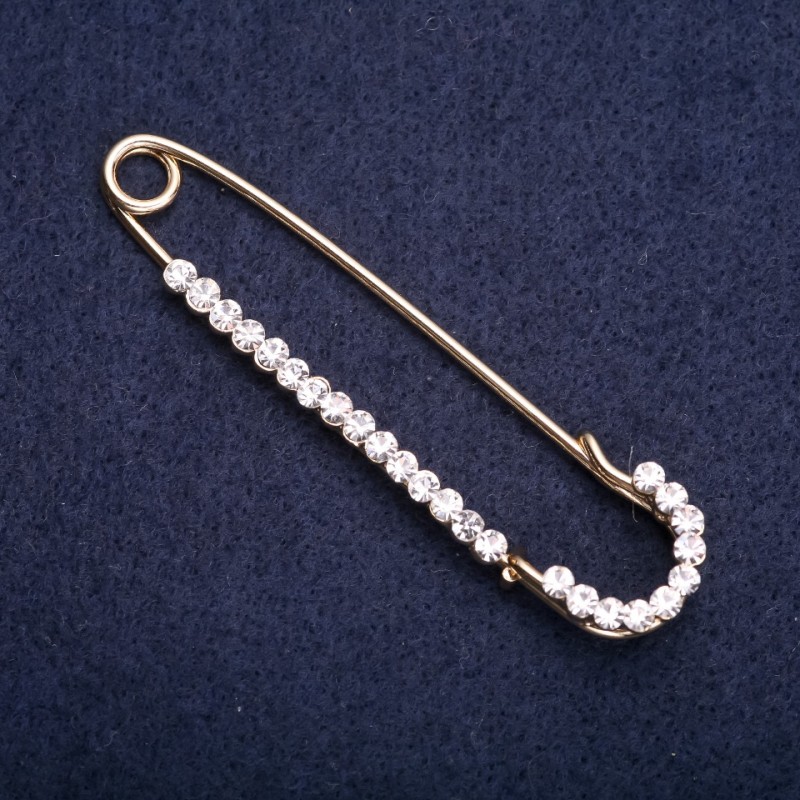 Broche avec épingle et strass blancs, métal jaune, 70 × 16 mm