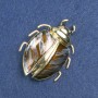 Broche Insecte doré — métal doré, émail brun et strass noirs 58×24 mm +