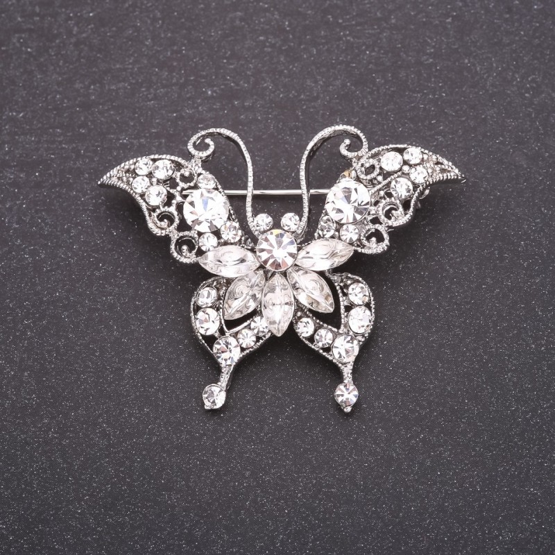 Broche Papillon avec strass blancs 40×50 mm métal blanc