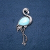 Broche-pendante Flamant avec turquoise artificielle 85×30 mm