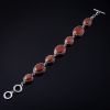 Liquidation. Bracelet en aventurine «Sable doré» monture à griffes, pierres ovales 7 pièces, 20 × 16 mm et 13 × 16 mm, longueur 18–21 cm